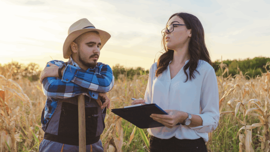 An image of a local farmer in Woodstock who is meeting with his local CPA to discuss strategy for his agricultural business.