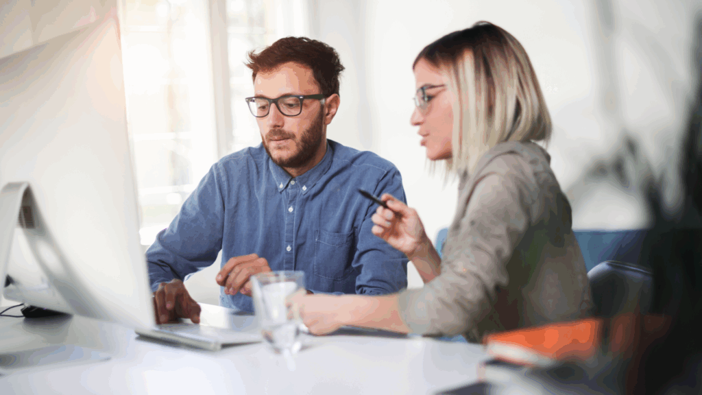 An image of a small business owner in Oxford County who is chatting with his local CPA about the financial health of his business.